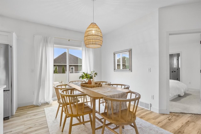 320 N John St, Kimberly, WI 54136 - dining room with light wood-style floors and baseboards