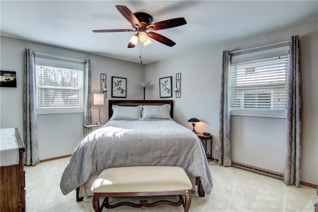 709 E Fillmore Ave, Eau Claire, WI 54701 - carpeted bedroom with baseboards and a ceiling fan