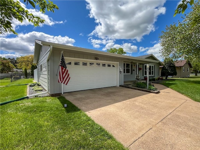 709 E Fillmore Ave, Eau Claire, WI 54701 - single story home featuring a front lawn, an attached garage, and driveway
