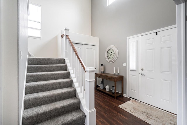 6544 Biscayne Ave, Mount Pleasant, WI 53406 - entrance foyer with dark wood-style floors, stairway, a high ceiling, and baseboards
