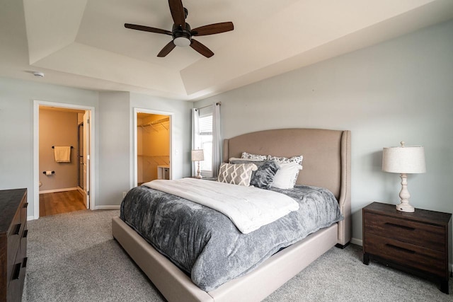 6544 Biscayne Ave, Mount Pleasant, WI 53406 - bedroom with carpet, a raised ceiling, a walk in closet, baseboards, and ceiling fan