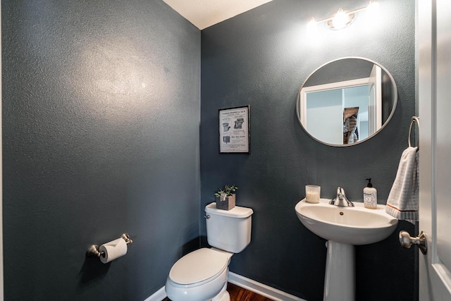 6544 Biscayne Ave, Mount Pleasant, WI 53406 - bathroom with toilet, baseboards, wood finished floors, and a sink