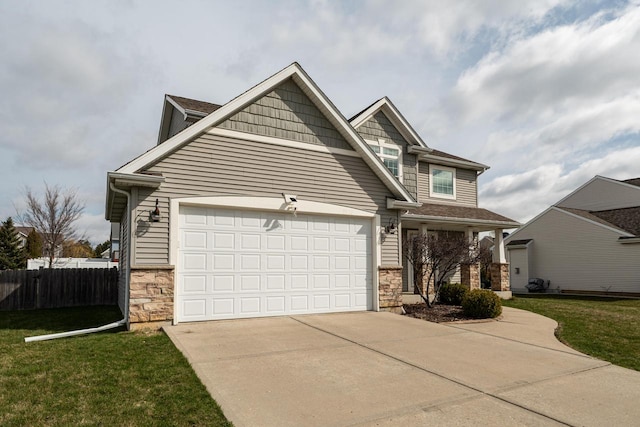 6544 Biscayne Ave, Mount Pleasant, WI 53406 - craftsman-style house featuring stone siding, driveway, and an attached garage