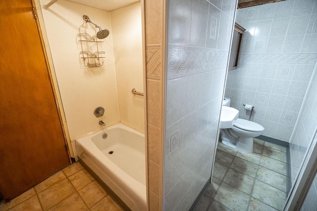 3324 96th St, Sturtevant, WI 53177 - bathroom featuring toilet, bathtub / shower combination, and tile walls