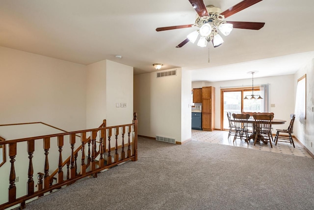 3324 96th St, Sturtevant, WI 53177 - interior space with an upstairs landing, light colored carpet, baseboards, and a chandelier