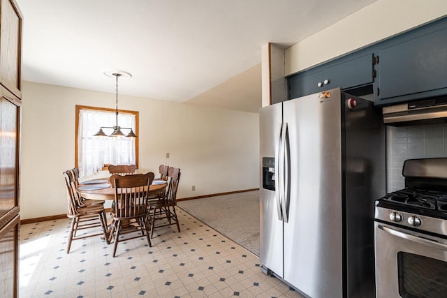 3324 96th St, Sturtevant, WI 53177 - kitchen featuring stainless steel appliances, light flooring, baseboards, exhaust hood, and hanging light fixtures