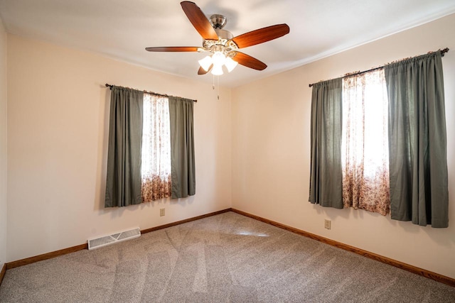 3324 96th St, Sturtevant, WI 53177 - empty room with healthy amount of natural light, carpet floors, ceiling fan, and baseboards
