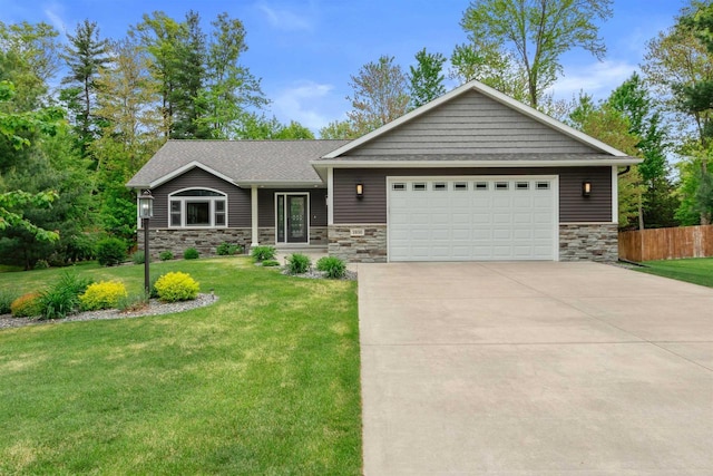 1930 Waterview Blvd, Plover, WI 54467 - view of front facade with stone siding, concrete driveway, a garage, and a shingled roof