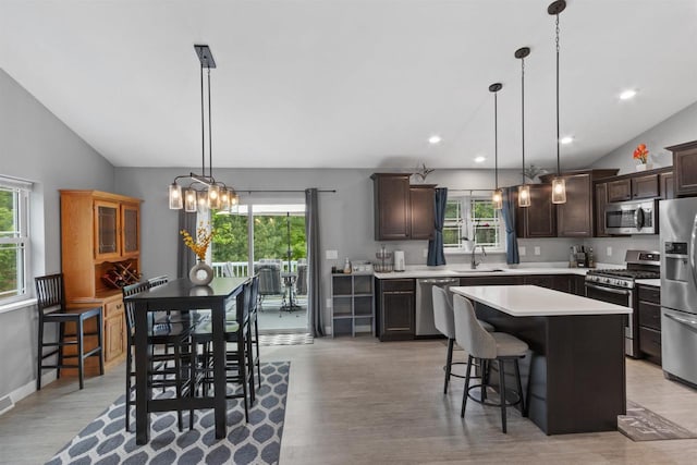 1930 Waterview Blvd, Plover, WI 54467 - kitchen featuring stainless steel appliances, healthy amount of natural light, vaulted ceiling, light wood-style floors, and recessed lighting