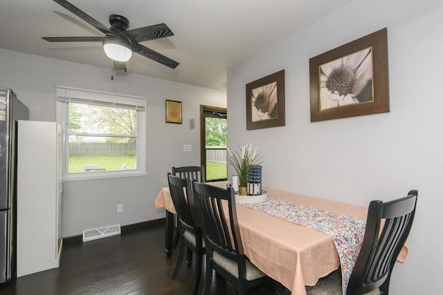 10065 S Cindy Ln, Oak Creek, WI 53154 - dining room featuring dark wood-style floors, healthy amount of natural light, a ceiling fan, and baseboards