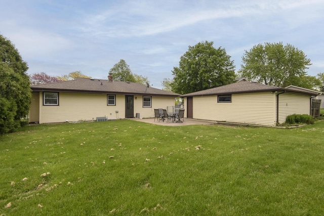 10065 S Cindy Ln, Oak Creek, WI 53154 - rear view of house with a patio, a yard, and central AC