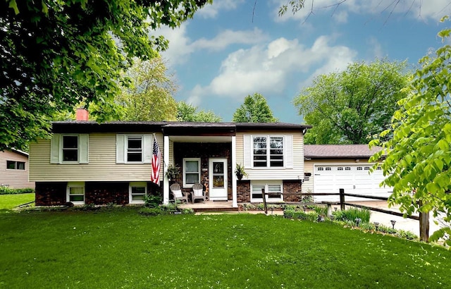 2621 Golf Course Rd, Wisconsin Rapids, WI 54494 - view of front of property featuring a front yard, an attached garage, a chimney, and brick siding