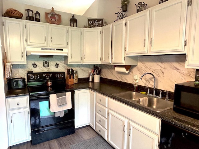 2621 Golf Course Rd, Wisconsin Rapids, WI 54494 - kitchen with black appliances, under cabinet range hood, a sink, decorative backsplash, and dark countertops
