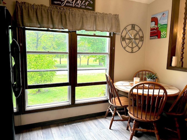 2621 Golf Course Rd, Wisconsin Rapids, WI 54494 - dining space featuring wood finished floors and baseboards