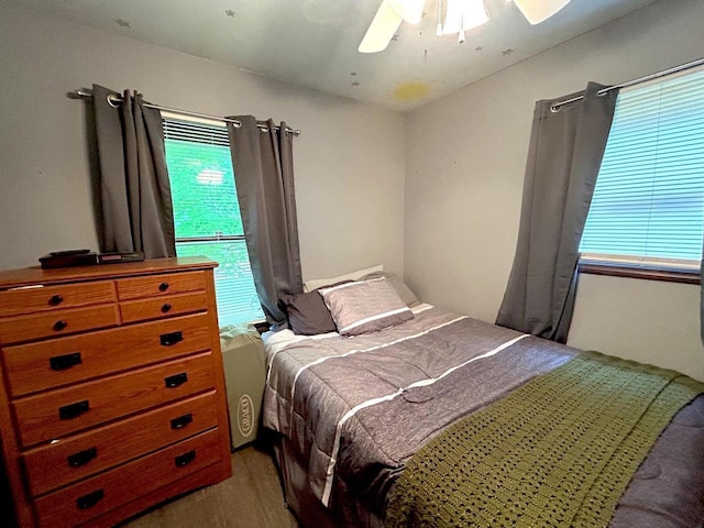 2621 Golf Course Rd, Wisconsin Rapids, WI 54494 - bedroom with wood finished floors and a ceiling fan