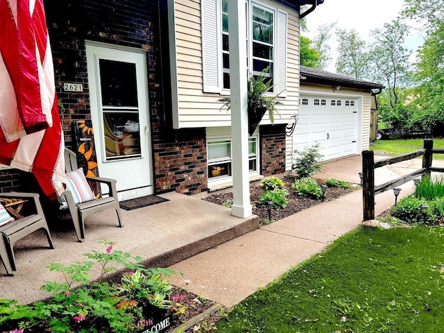 2621 Golf Course Rd, Wisconsin Rapids, WI 54494 - doorway to property featuring brick siding and an attached garage