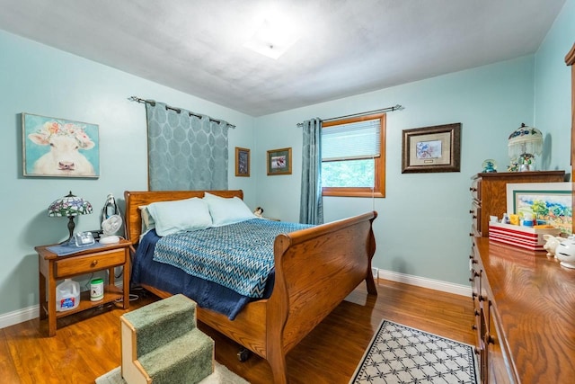 503 N 43rd Ave, Wausau, WI 54401 - bedroom with baseboards and wood finished floors