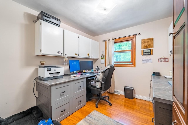 503 N 43rd Ave, Wausau, WI 54401 - office area with light wood-type flooring, built in study area, and baseboards