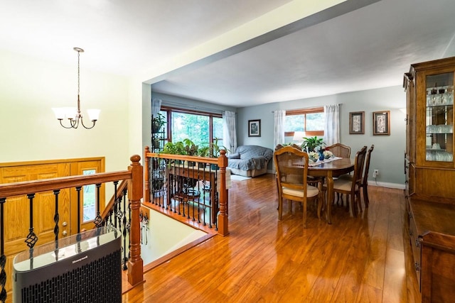 503 N 43rd Ave, Wausau, WI 54401 - dining space with wood finished floors, a chandelier, healthy amount of natural light, and baseboards