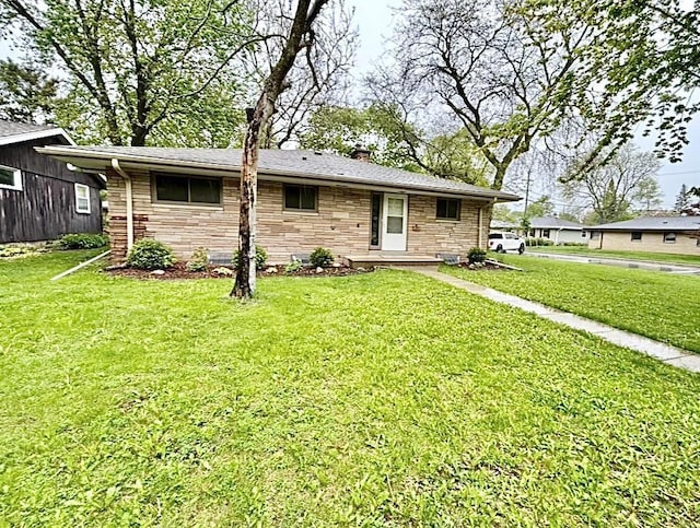 5404 N Bethmaur Ln, Milwaukee, WI 53209 - ranch-style home with stone siding, a front lawn, and a chimney