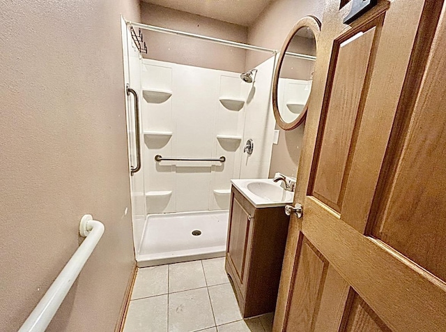 5404 N Bethmaur Ln, Milwaukee, WI 53209 - bathroom with vanity, a textured wall, tile patterned flooring, and a shower stall