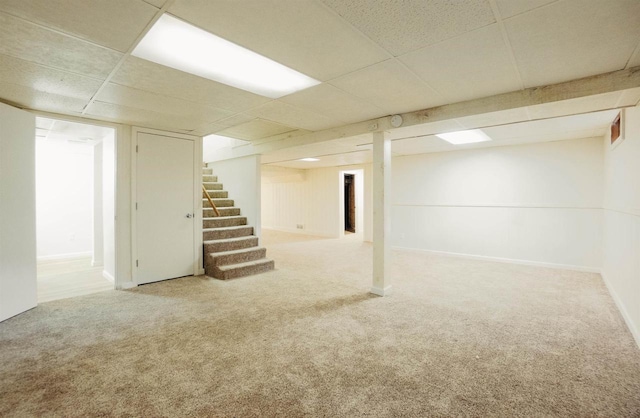 85 N Reserve Ave, Fond Du Lac, WI 54935 - finished basement with a paneled ceiling, stairs, and carpet