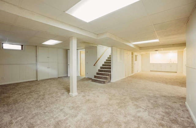 85 N Reserve Ave, Fond Du Lac, WI 54935 - below grade area featuring carpet flooring, a drop ceiling, and stairway