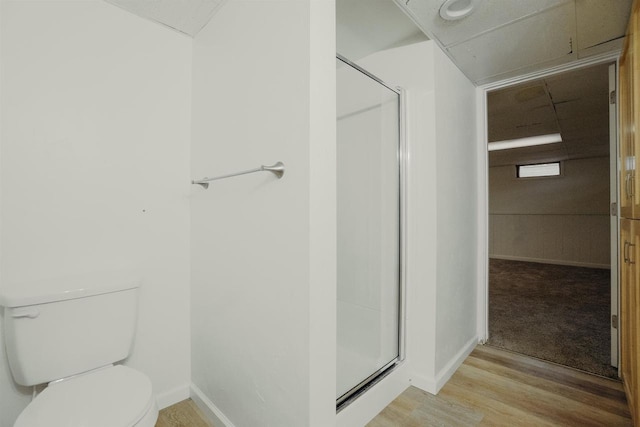 85 N Reserve Ave, Fond Du Lac, WI 54935 - full bathroom with a stall shower, toilet, wood finished floors, and baseboards
