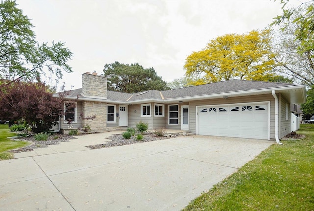 85 N Reserve Ave, Fond Du Lac, WI 54935 - single story home with a garage, a chimney, concrete driveway, roof with shingles, and a front yard