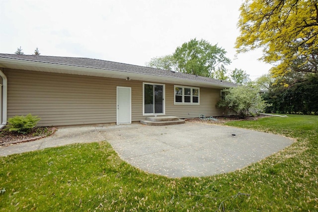 85 N Reserve Ave, Fond Du Lac, WI 54935 - back of house with a lawn, a patio, and a shingled roof