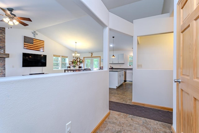 5304 Ski Ln, Weston, WI 54476 - hall featuring vaulted ceiling, a chandelier, stone finish flooring, and baseboards