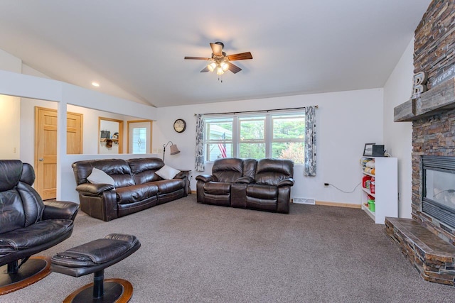 5304 Ski Ln, Weston, WI 54476 - living area with lofted ceiling, carpet, a stone fireplace, ceiling fan, and baseboards