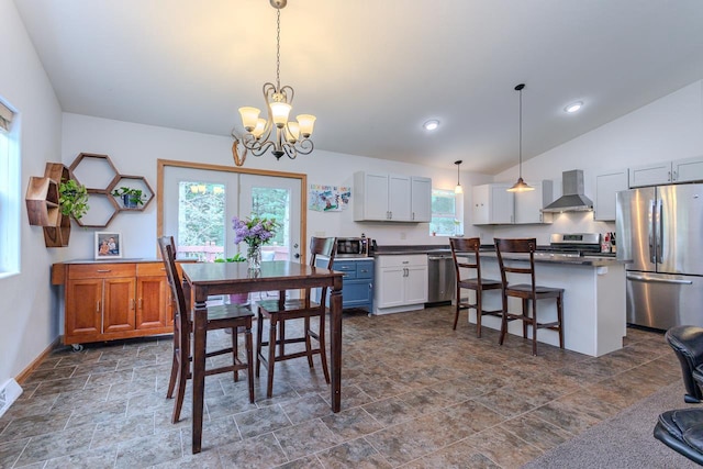 5304 Ski Ln, Weston, WI 54476 - dining area with a chandelier, dark stone finish flooring, lofted ceiling, baseboards, and recessed lighting