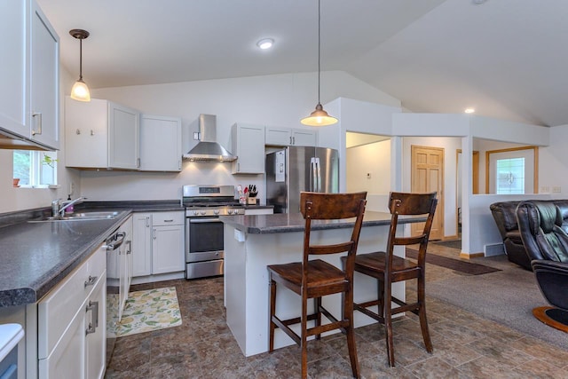 5304 Ski Ln, Weston, WI 54476 - kitchen with stainless steel appliances, wall chimney range hood, a sink, vaulted ceiling, and dark countertops