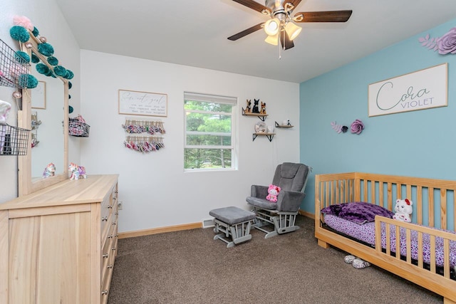 5304 Ski Ln, Weston, WI 54476 - bedroom with dark colored carpet, a crib, baseboards, and a ceiling fan