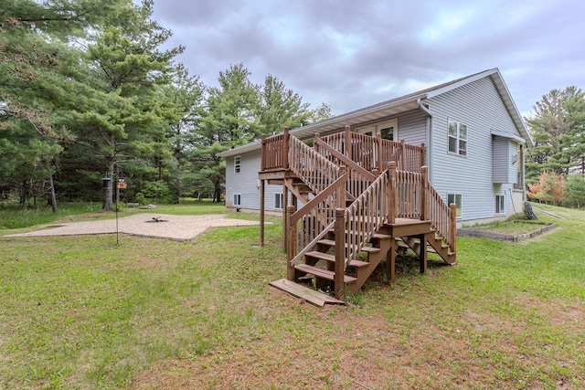 5304 Ski Ln, Weston, WI 54476 - rear view of house featuring stairs, a wooden deck, a lawn, and a patio area