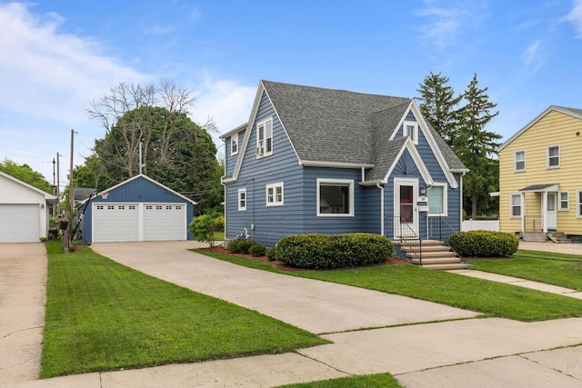 768 Reed St, Neenah, WI 54956 - view of front of house featuring a garage, a front lawn, a shingled roof, and an outbuilding