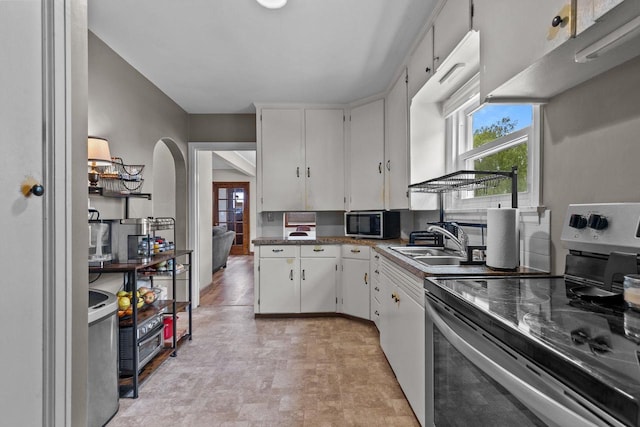768 Reed St, Neenah, WI 54956 - kitchen featuring appliances with stainless steel finishes, plenty of natural light, and white cabinets