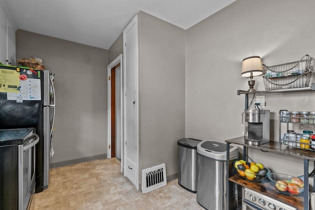 768 Reed St, Neenah, WI 54956 - kitchen with appliances with stainless steel finishes and baseboards