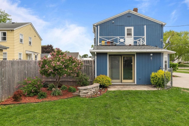 768 Reed St, Neenah, WI 54956 - back of house featuring a balcony, board and batten siding, and a chimney