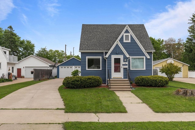 768 Reed St, Neenah, WI 54956 - view of front of home featuring an outbuilding, a detached garage, a front lawn, and a shingled roof
