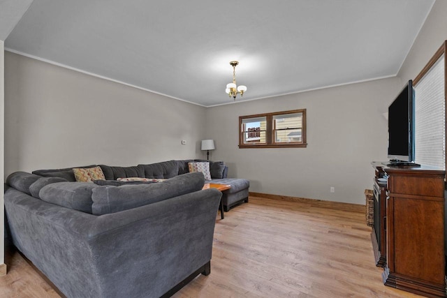 768 Reed St, Neenah, WI 54956 - living area featuring ornamental molding, light wood finished floors, a chandelier, and baseboards