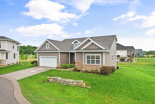 5829 Prairie Cloud Ct, Waunakee, WI 53597 - craftsman-style home with board and batten siding, stone siding, driveway, a front yard, and an attached garage