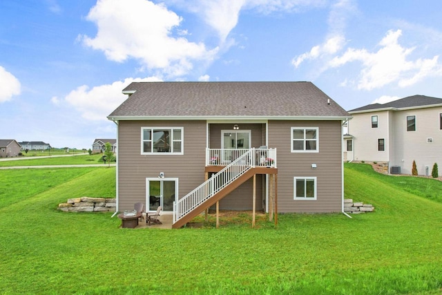 5829 Prairie Cloud Ct, Waunakee, WI 53597 - rear view of house featuring stairway, a lawn, and a wooden deck