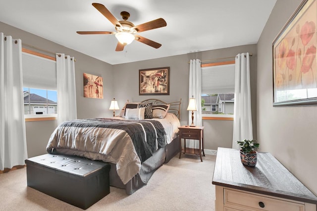 6905 Jamestown Ct, West Bend, WI 53090 - bedroom featuring multiple windows, light carpet, and ceiling fan