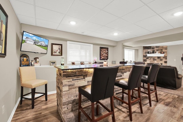 6905 Jamestown Ct, West Bend, WI 53090 - indoor bar with a paneled ceiling, wood finished floors, and baseboards