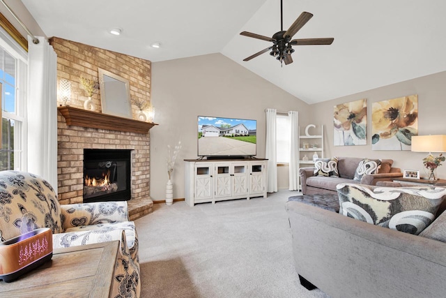 6905 Jamestown Ct, West Bend, WI 53090 - carpeted living room featuring ceiling fan, high vaulted ceiling, a fireplace, and baseboards