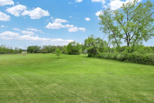 6905 Jamestown Ct, West Bend, WI 53090 - view of green lawn featuring view of golf course and view of scattered trees