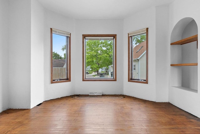 314 Summit St, Pulaski, WI 54162 - spare room with hardwood / wood-style floors and built in shelves
