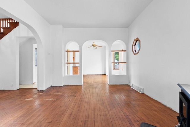 314 Summit St, Pulaski, WI 54162 - unfurnished room featuring arched walkways, hardwood / wood-style flooring, and ceiling fan